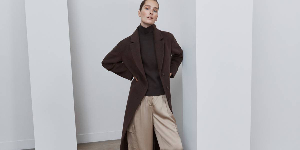Woman wearing earth-toned outfit. Shop women’s Autograph 